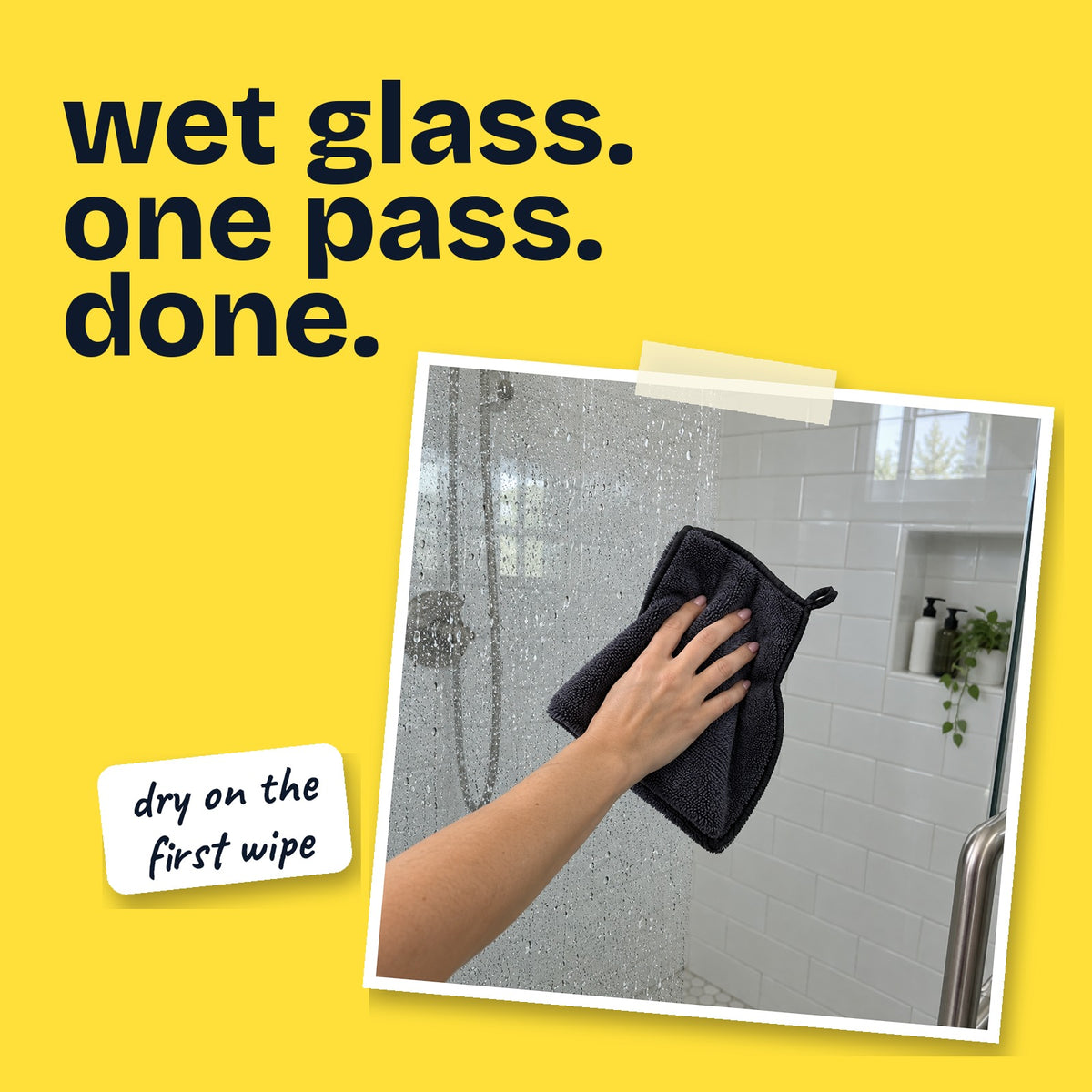 Wiping a wet glass shower door dry in one pass